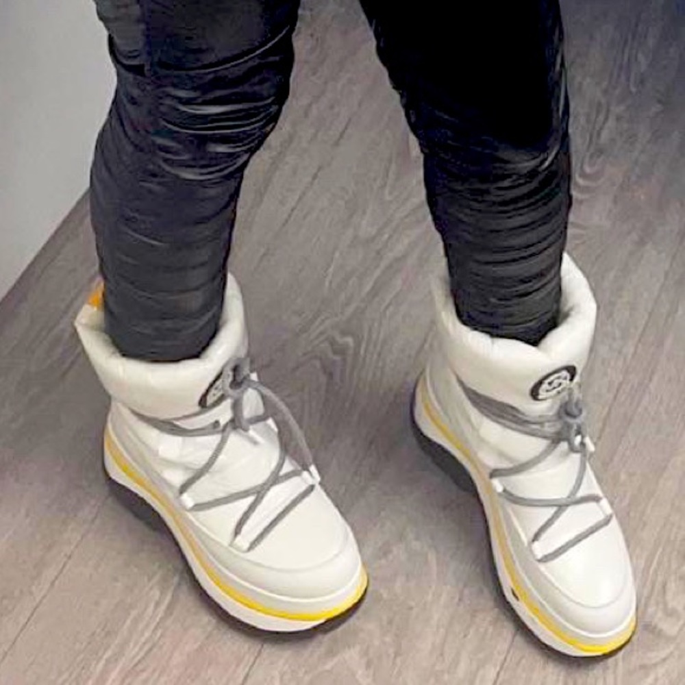 Black, white and yellow Michael Kor Snow boots